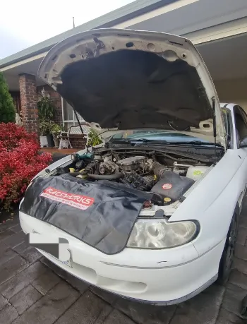 car with open hood