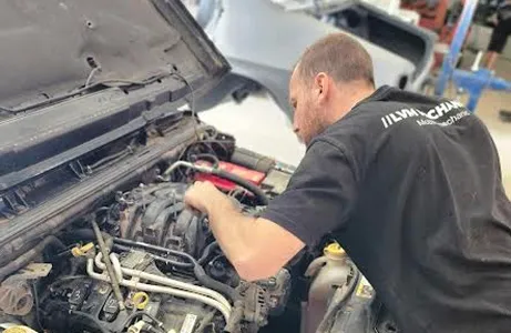 mechanic working on vehicle