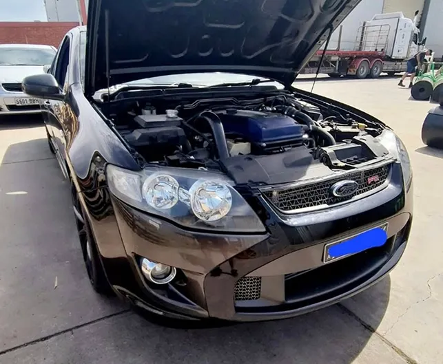 car with open hood